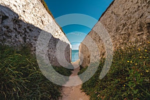 Empty Kingsgate Beach, walking through the chalk stacks clifs at Botany Bay in Kent, England