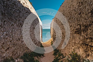 Empty Kingsgate Beach, walking through the chalk stacks clifs at Botany Bay in Kent, England