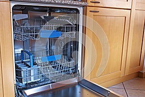 Empty kitchen dishwasher photo