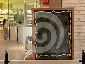 Empty large menu board indoor cafe, blank wooden black board at restaurant