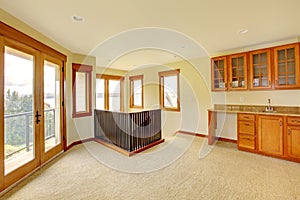Empty large room with wood cabinets. New luxury home interior.