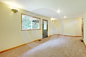 Empty large white bright living room in a new home