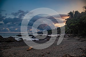 Empty Las Manchas beach after sunset, Montezuma, Costa Rica photo