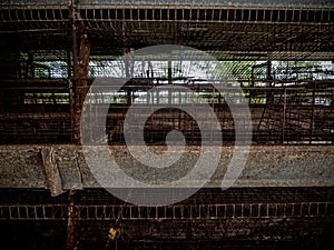 The empty laying cages of poultry houses, old, decayed, abandoned