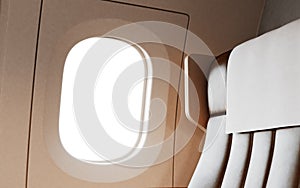 Empty Leather Chair Background Inside Interior First Class Airplane Private Jet. Blank White Illuminator Mockup Ready