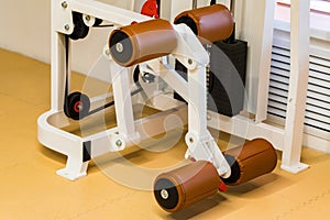 Empty leg extension exercise machine in modern gym