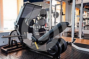 Empty leg press exercise machine in modern gym