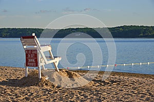 An empty lifeguard chair on a beach in Lloyd Harbor, NY