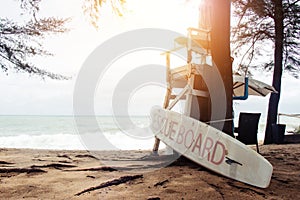 Empty lifeguard stand with rescue board on the beach at Phuket