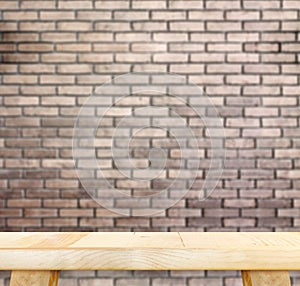 Empty light wood table and blur red brick wall in background,Moc