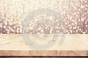 Empty light wooden table top, counter on blurred bokeh lights party background