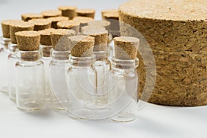 Empty little bottles with cork stopper isolated on white. transparent containers. test tubes. big cork