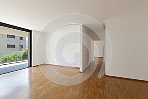 Empty living room with balcony