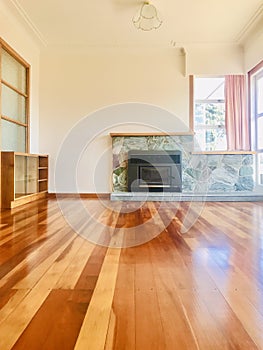 Empty living room with fire place.  Sunny living room interior .