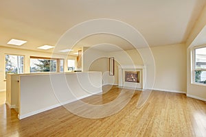 Empty living room interior with polished hardwood floor.