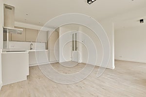 an empty living room and kitchen in a house