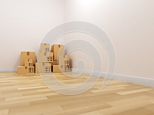 Empty living room with parquet floor and stack of moving boxes