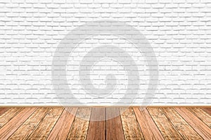 Empty living room with wooden floor and white painted brick wall background.