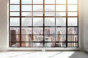 Empty loft interior with city view photo