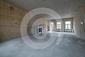 Empty loft room with brick wall and repair and without furniture for office