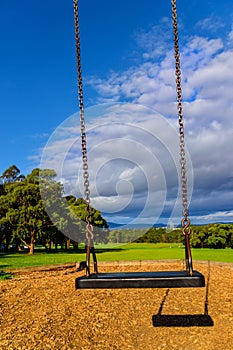 Empty lonely swing in the playgrouind