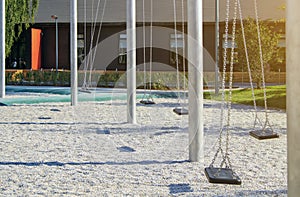 empty lonely swings in a modern park