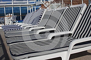 Empty lounge chair on the cruise ship