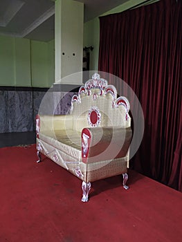Empty luxury red velvet and gold armchair. Hindu Wedding Royal Arm Chair for Reception to sit Bride and Bridegroom