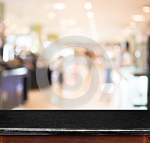 Empty marble table and blur store in background. product display