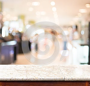 Empty marble table and blurred store in background. product display template