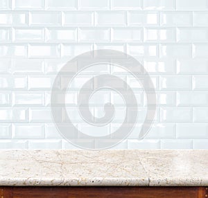 Empty marble table and ceramic tile brick wall in background. pr