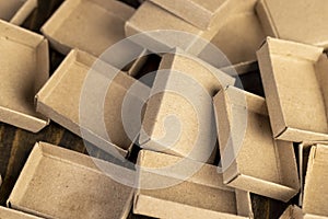 empty matchboxes scattered in a pile , several matchboxes made of paper