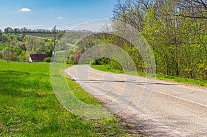 Empty meandering road through small village Petro-Svistunovo in central Ukraine