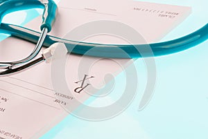 Empty medical prescription with stethoscope