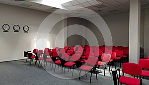 Empty meeting room with red chairs