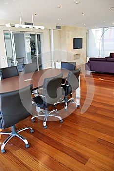 Empty meeting table and chairs in a modern conference room. Business meetings and ideas can be exchanged