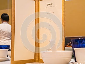 Empty menu and white bowl in luxury hotel