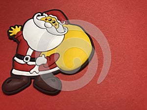 Empty message area with father christmas figure as note paper or message board on red background