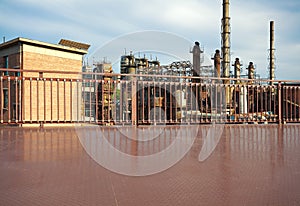 Empty metal road surface floor with old steel steelworks of pipe