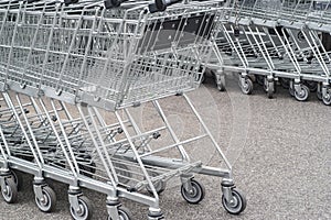 Empty metal shopping cart in a grocery store