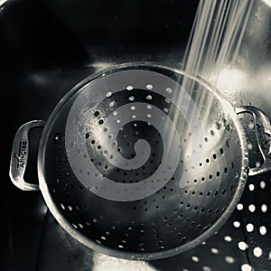 Empty metal strainer