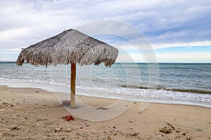 Empty Mexican coastal beach with a palapa with Sea of Cortez in background