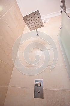 Empty minimalistic interior background, bathroom of modern apartment, inside shower cabin, tap closeup