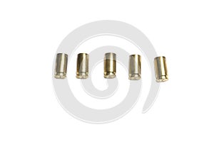 Empty 9mm bullet shells over white background