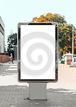 Empty mock-up of a vertical billboard street poster in the background of the city