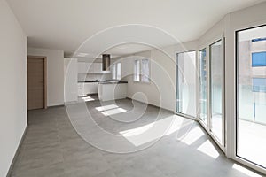 Empty modern apartment, empty spaces and white walls photo