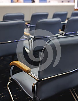 Empty modern conference hall, venue for congress lecture, line row of chairs, auditorium for convention and press conference event