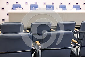 Empty modern conference hall, venue for congress lecture, line row of chairs, auditorium for convention and press conference event