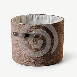 Empty modern cylinder shaped boucle storage basket with leather handle