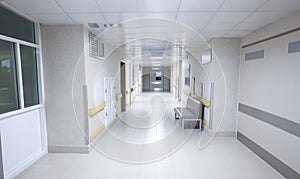 Empty modern hospital corridor with sitting couch